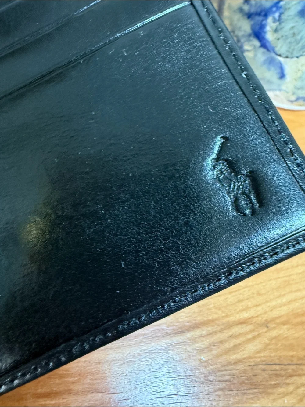 Polo Ralph Lauren bi-fold leather wallet in black featuring a debossed logo